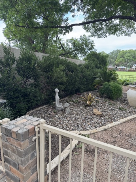 Landscaped gravel bed and stone border beside a finished wall